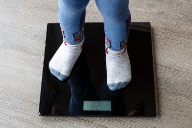 Child on a weight scale.
