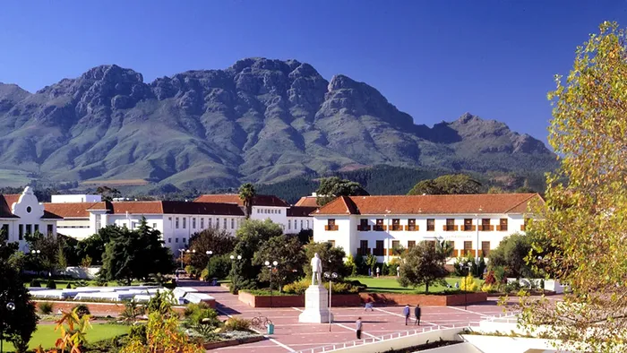 Image of part of the campus at Stellenbosch University with mountains in the background.