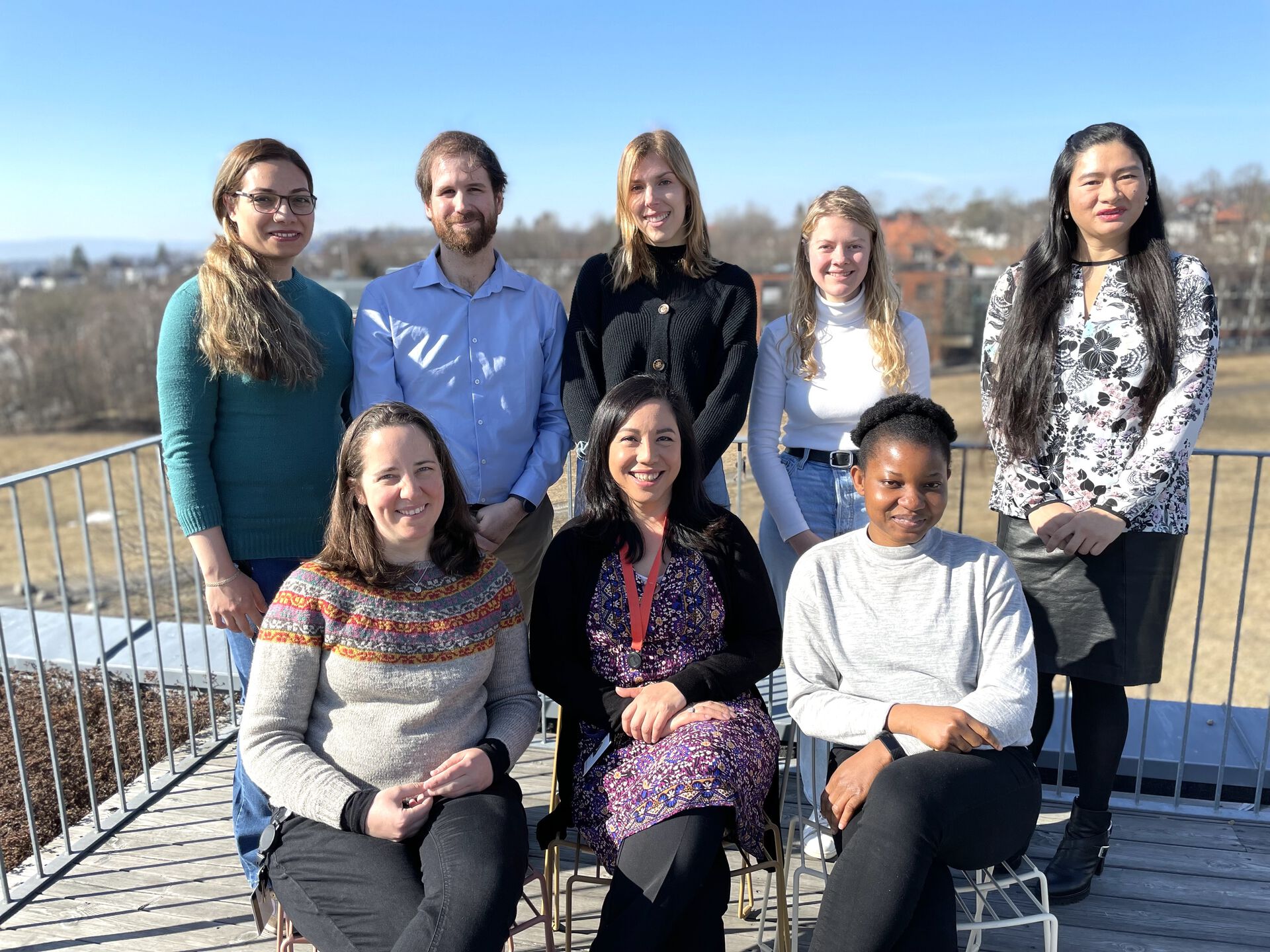 Group photo of the Chemical Neuroscience and Zebrafish Core Facility Group. They are posing on the roof of NCMM and smiling.
